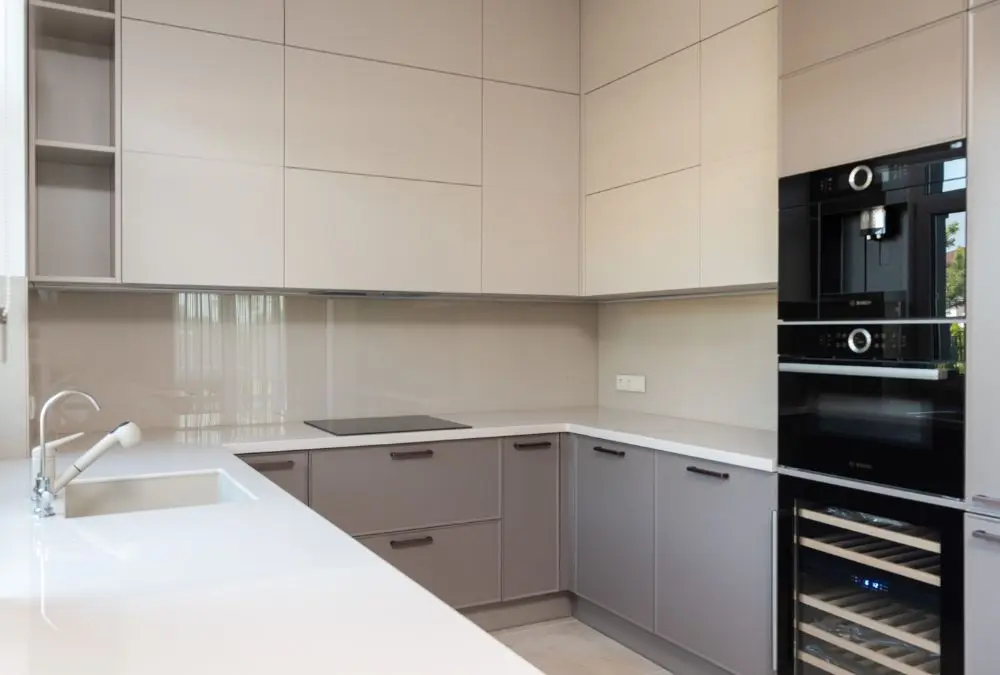 Built-in appliance placement to maximize space in a small kitchen