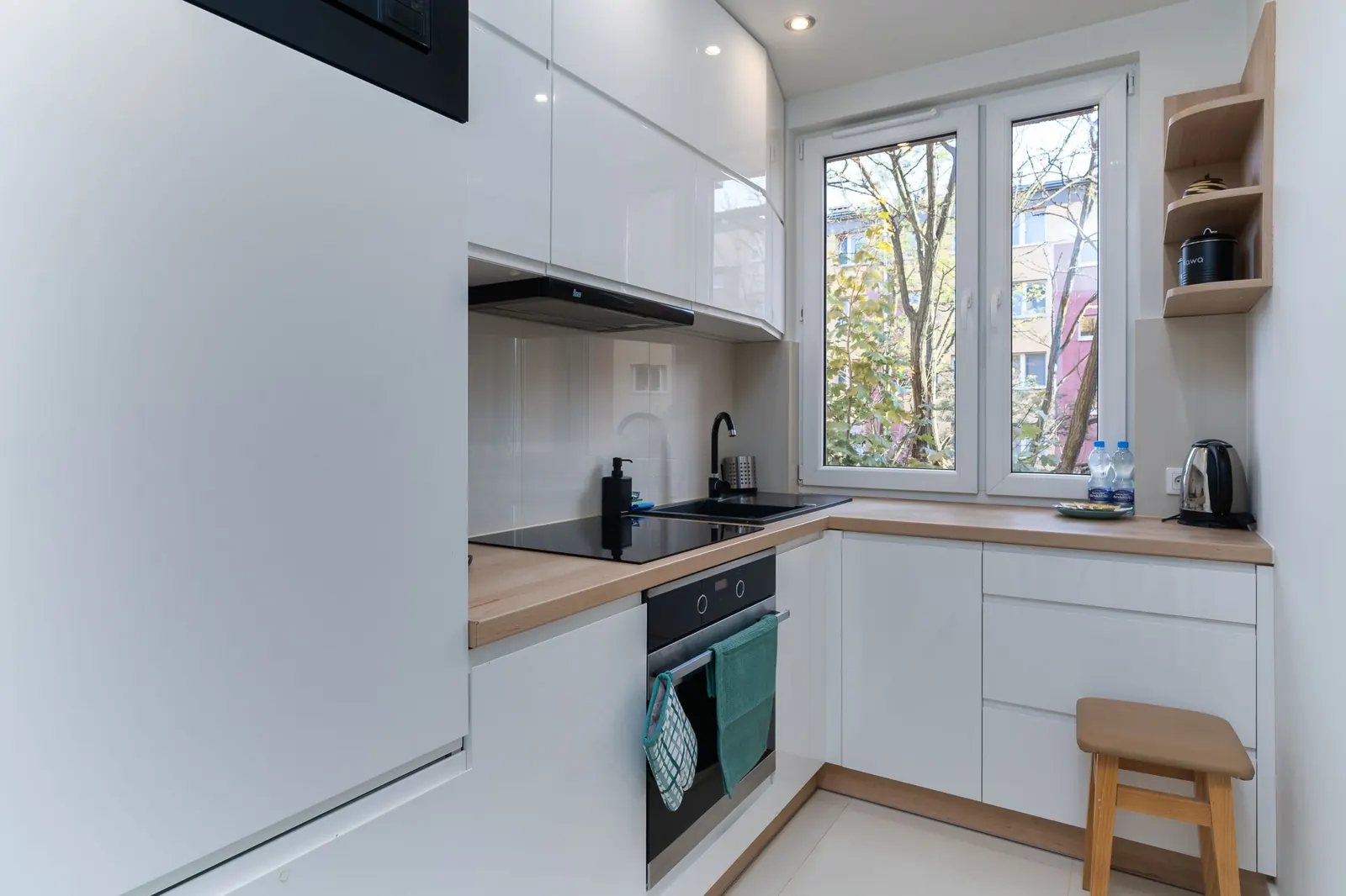 Small kitchen ideas featuring light cabinetry and an efficient, uncluttered layout