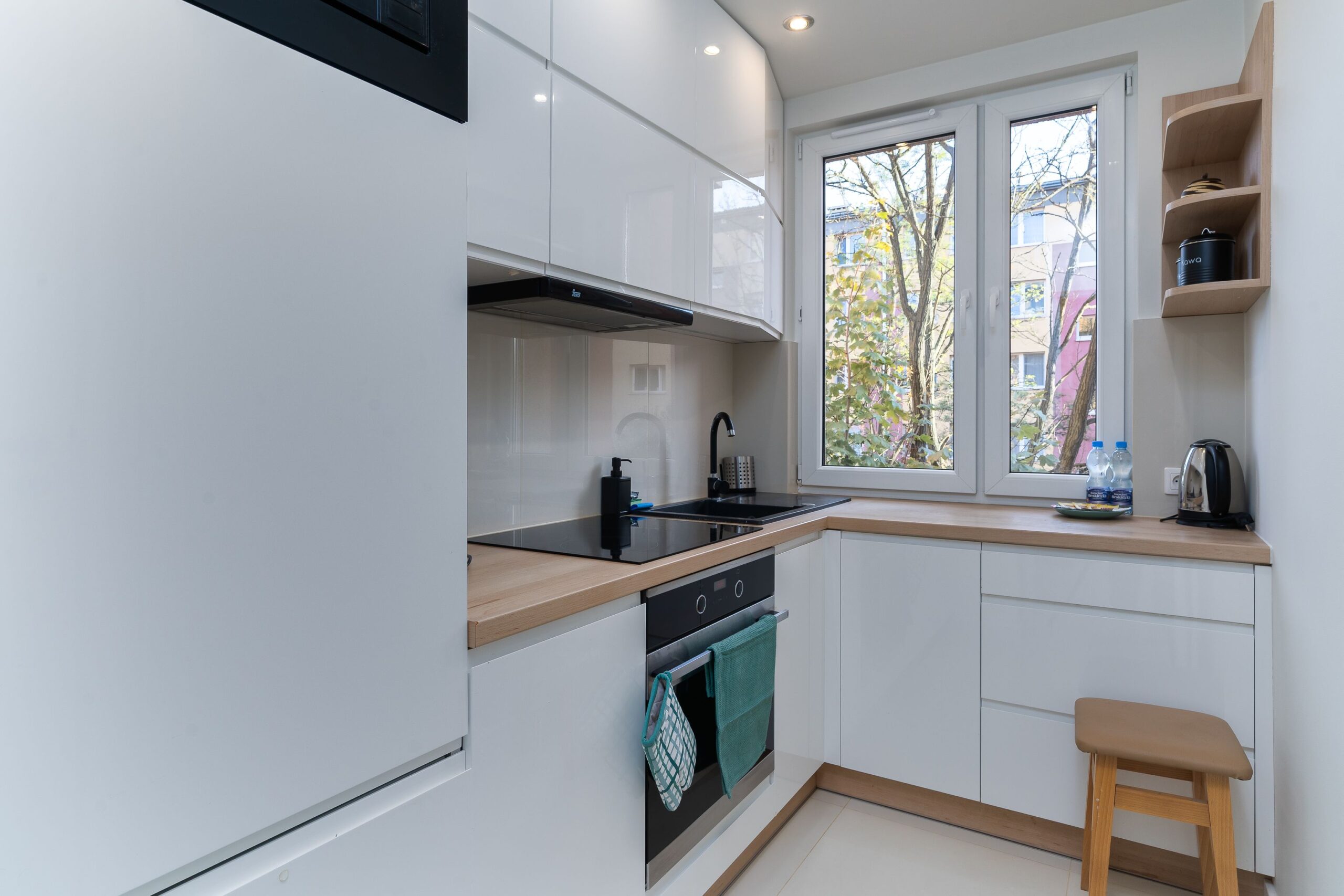 Small kitchen ideas featuring light cabinetry and an efficient, uncluttered layout