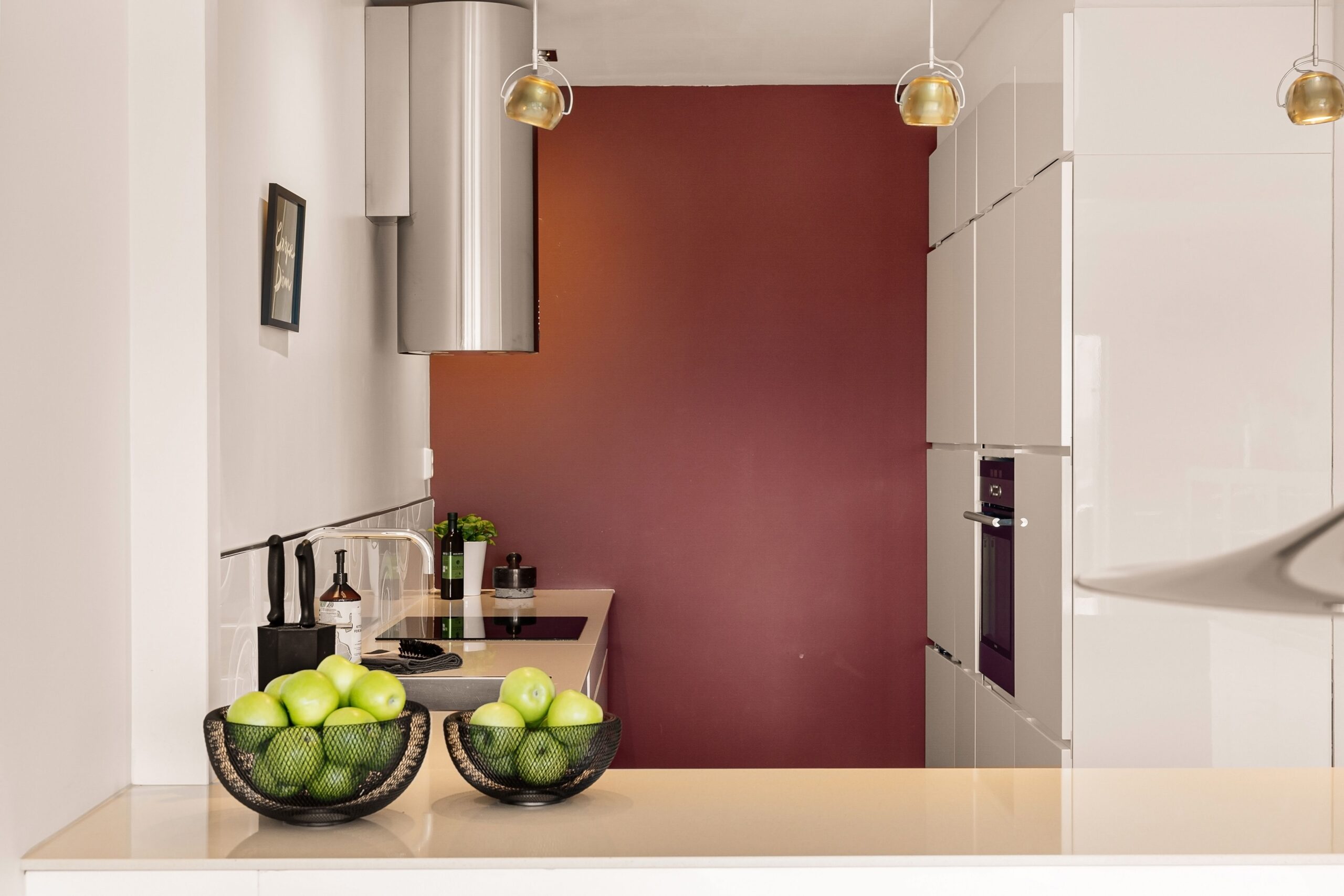 Small kitchen renovation ideas: a pale, warm accent wall painted for under $50