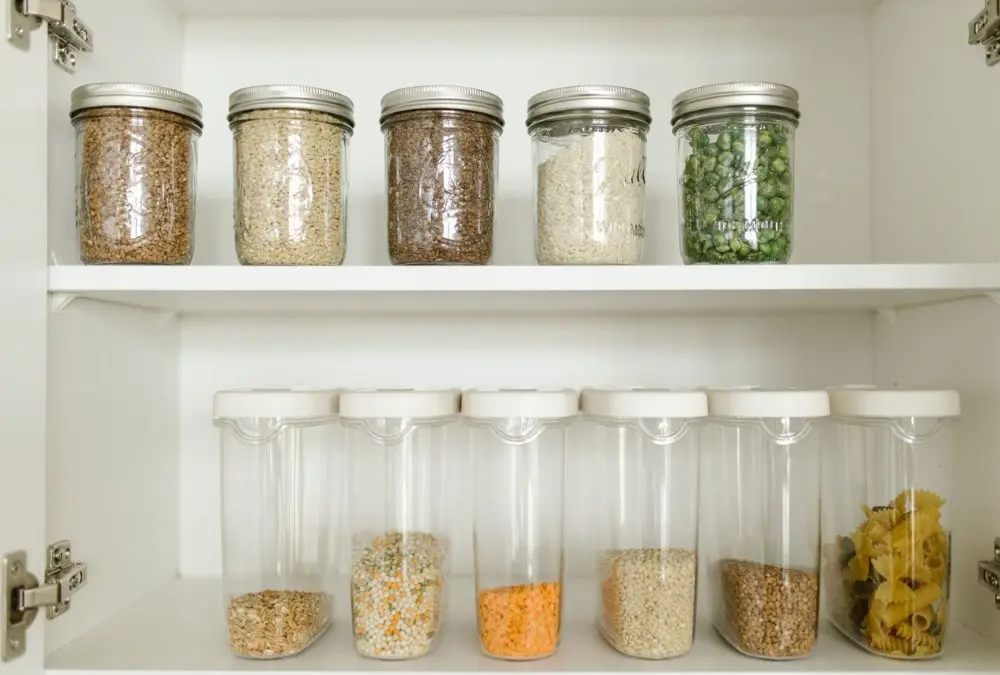 Small kitchen storage products: stackable clear containers keeping pantry staples visible