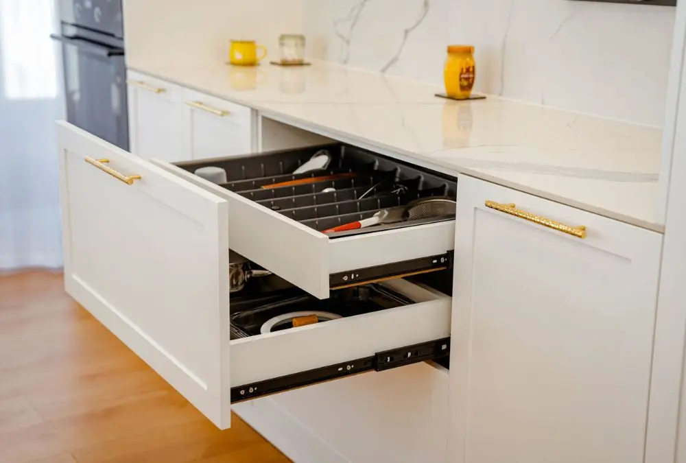 Small kitchen storage products: a drawer organizer keeping utensils sorted and visible