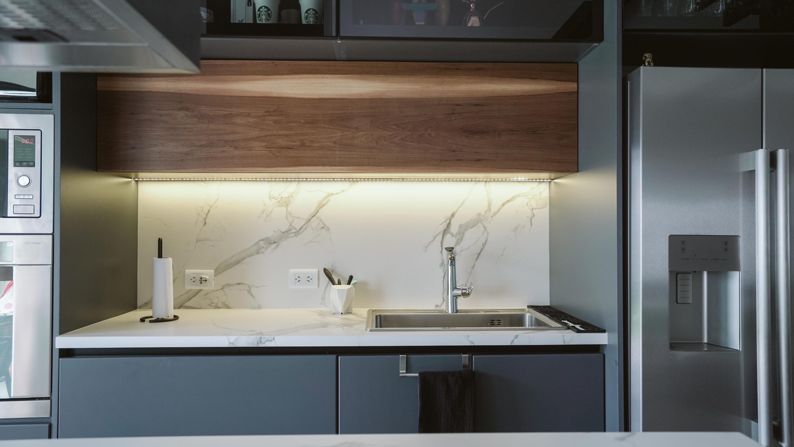 One of the most cost-effective small kitchen renovation ideas: warm under-cabinet LED lighting